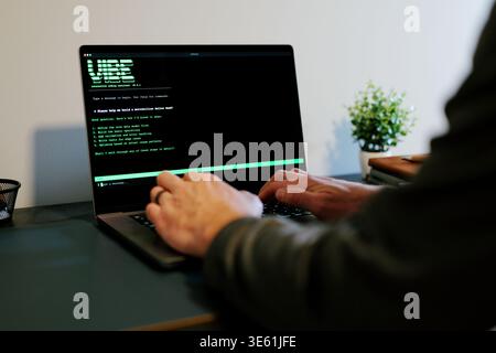 Middle Aged Man Turns Hacker in Hoodie After Using Vibe Coding Command Line Interface Artificial Intelligence Large Language Model Assistant Concept Stock Photo