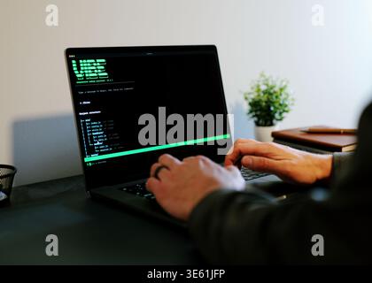 Middle Aged Man Turns Hacker in Hoodie After Using Vibe Coding Command Line Interface Artificial Intelligence Large Language Model Assistant Concept Stock Photo