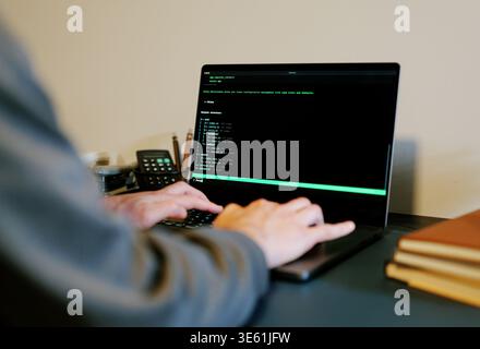 Middle Aged Man Turns Hacker in Hoodie After Using Vibe Coding Command Line Interface Artificial Intelligence Large Language Model Assistant Concept Stock Photo