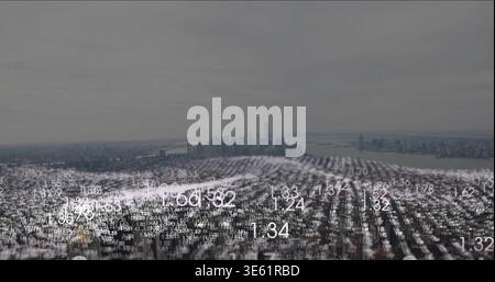 Hovering translucent data mesh undulating over urban harbor skyline, showing white numeric figures Stock Photo