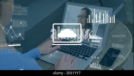 Typing man in blue shirt using laptop at outdoor patio, showing woman with glasses, data overlays Stock Photo