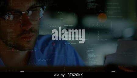 Gazing man in blue shirt focusing on screen at desk, glasses reflecting code, copy space Stock Photo