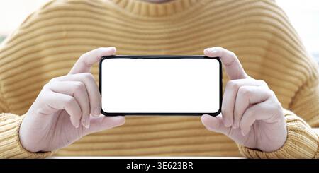 Hand holding phone mobile and touching screen isolated on white background, mock-up smartphone matte black color Stock Photo