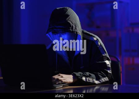 Hacker executing cyberattack representing data breach, system infiltration, and cybersecurity threat Stock Photo