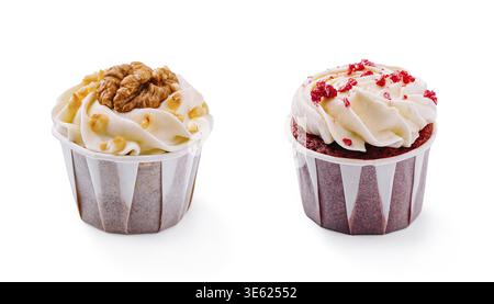 Food, Two tempting cupcakes are displayed side by side. One features a rich cream topping with chopped walnuts, while the other has vibrant red sprink Stock Photo
