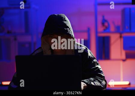Hacker executing cyberattack representing data breach, system infiltration, and cybersecurity threat Stock Photo