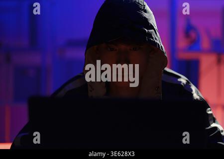 Hacker initiating cyberattack to infiltrate systems, steal data, and exploit cybersecurity weaknesses in digital networks Stock Photo