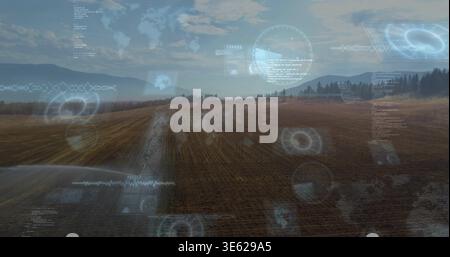 Displaying plowed field showing furrows with central dirt track at rural farm, overlaying HUD Stock Photo