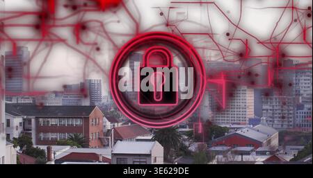 Glowing neon padlock symbol hovering over cityscape, displaying red circuit lines and rooftops Stock Photo
