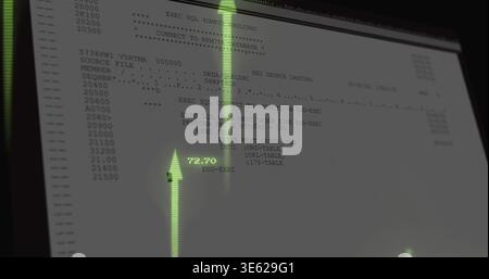 Showing monitor displaying terminal code with line numbers at dim desk, with green HUD 72 Stock Photo