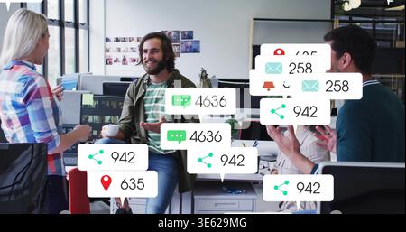Speaking bearded man on desk wearing striped olive-shirt holding mug in office with alert overlays Stock Photo