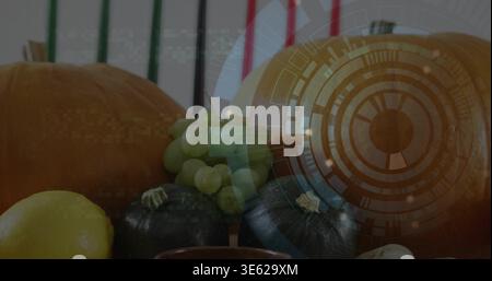 Displaying still life on tabletop with orange pumpkins, grapes, squashes, lemon bowl, HUD overlay Stock Photo