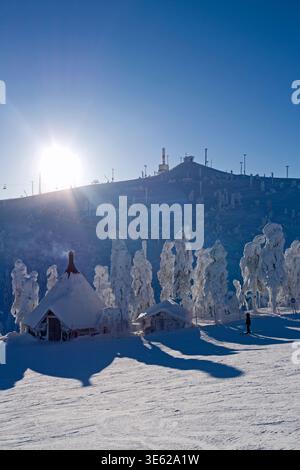 Kuusamo, Finland – 12.02.2019: View from Saatura top with the typical Lapland hut to Rukatunturi top on a beautiful winter day Stock Photo