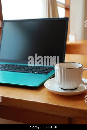 Laptop and Coffee, Calm Start to Digital Work Stock Photo