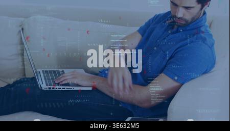 Reclining man wearing blue shirt jeans typing on silver laptop on beige couch tablet code overlays Stock Photo