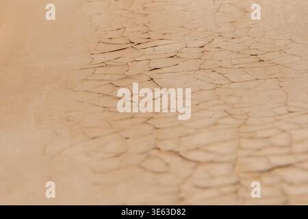 Peeling paint on wall forms detailed pattern of old coating material. Stock Photo