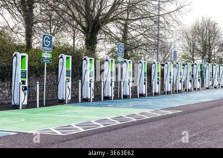 A row of empty Electric Vehicle (EV) chargers spotted at a motorway service station in the South West of the UK. Stock Photo