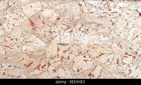 Natural cork texture in close-up with abstract organic pattern and red accents. Stock Photo
