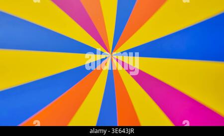 Bright rotating multicolored stripes on the wheel. Vibrant Radial Pattern with Bright Colors. Stock Photo