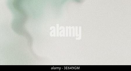 A green stain on a gray paper background texture with a rough surface and subtle gradient effect Stock Photo