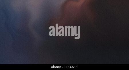 A dark blue and red gradient background with a textured surface, giving it a rough and uneven appearance. The colors blend smoothly into each other. Stock Photo