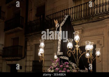 Our Lady of Consolation float from behind facing empty balconies during Holy Thursday procession, Alcoy, April 2, 2026, Spain Stock Photo