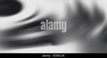 A black and white swirl design on a gray background with shadows creating a dramatic and contrasting visual composition with shades of black white and Stock Photo
