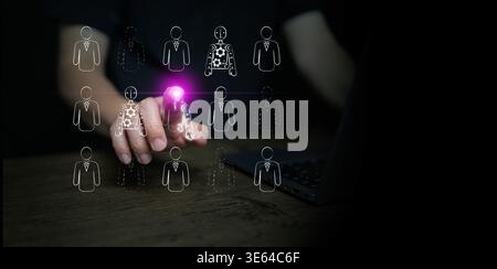 Businessman finger touching a human to robot icon. Concept of automation, artificial intelligence, job selection, AI displacement, work disruption in Stock Photo