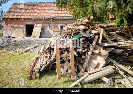 Demolition of an old building in the garden. Stock Photo