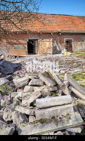 Demolition of an old building in the garden. Stock Photo