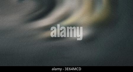 This image presents a dark abstract swirl design with shades of gray, black, and white on a dark textured background, resulting in a dramatic and inte Stock Photo