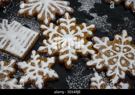 Decorated Snowflake Gingerbread Cookies on Black Background Stock Photo