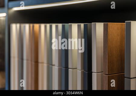 Kitchen cabinet samples on shelf with reflective display. Modern furniture material concept. Stock Photo