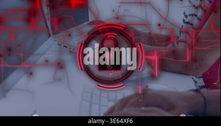 Typing hands in striped-tee band pressing keyboard with laptop at desk, red padlock circuit overlay Stock Photo