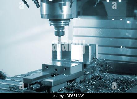 Metal processing machine. Machining center. CNC vertical machining center. Computer control. Metal milling equipment. Metal shavings. Machines production tools Industrial Stock Photo
