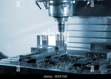 Metal processing machine. Machining center. CNC vertical machining center. Computer control. Metal milling equipment. Metal shavings. Machines production tools Industrial Stock Photo