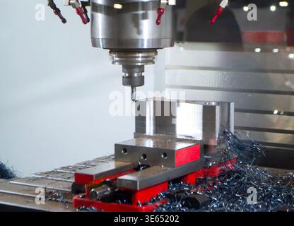 Metal processing machine. Machining center. CNC vertical machining center. Computer control. Metal milling equipment. Metal shavings. Machines production tools Industrial Stock Photo