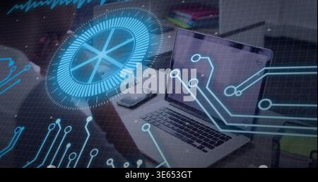 Showing open silver laptop with blue hologram circuit HUD at modern desk, with phone notebook pen Stock Photo