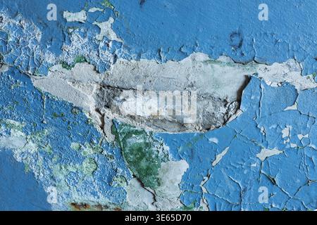Peeling and damaged blue painted wall texture, weathered and distressed surface Stock Photo