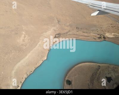 Minimalist aerial view of turquoise glacial water and sandy shore of Lake Argentino. Patagonia, El Calafate, Argentina. Stock Photo