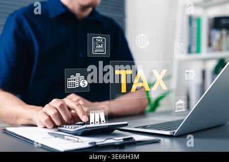 Tax payment concept with businessman using calculator and laptop. Professional male accountant calculating financial data with digital icons Stock Photo