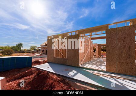 Workers are assembling wood frames for house at construction site on under framework progresses Stock Photo