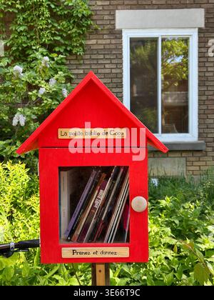 Little Free Library in a front garden in Montreal, Quebec, Canada Stock Photo