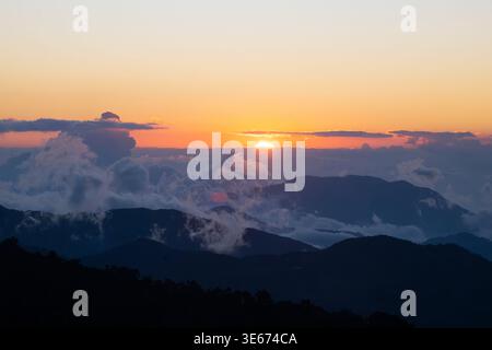 Atmospheric sunset over the cloudforest in Costa Rica, San Jose Province Stock Photo