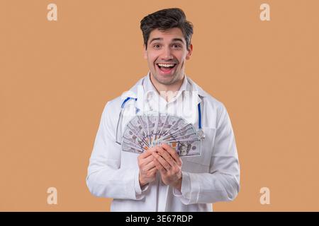 Rich Doctor Man with Usd money. Handsome Medical Health Care Worker In White Coat with salary, payment. Jackpot, win. High quality Stock Photo