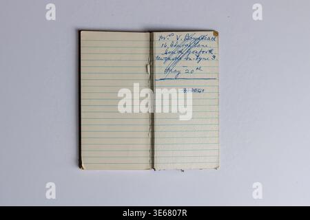 Vintage open notebook with handwritten address in blue ink Stock Photo