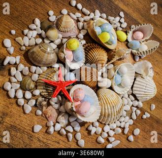 Easter beach with shells, eggs and starfish Stock Photo