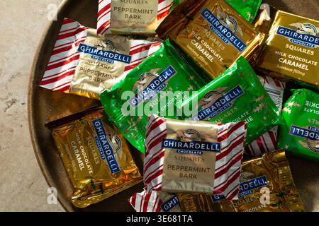 Los Angeles, California, United States - 12-01-2025: A top down view of a pile of assorted Ghirardelli chocolate, on a plate. Stock Photo