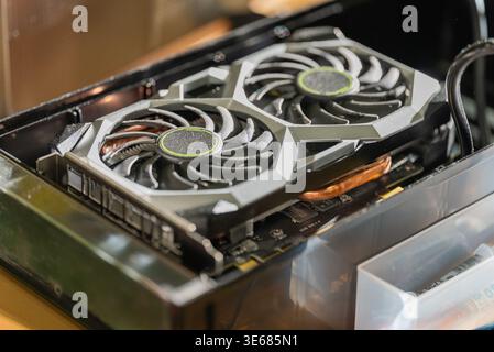 Close up of a dusty graphics card in a black container Stock Photo