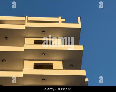 Abstract architectural view of modern building against clear blue sky background. Mobile photo Stock Photo